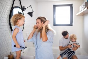 A family enjoying morning time in the bathroom free of smelly bathroom drains